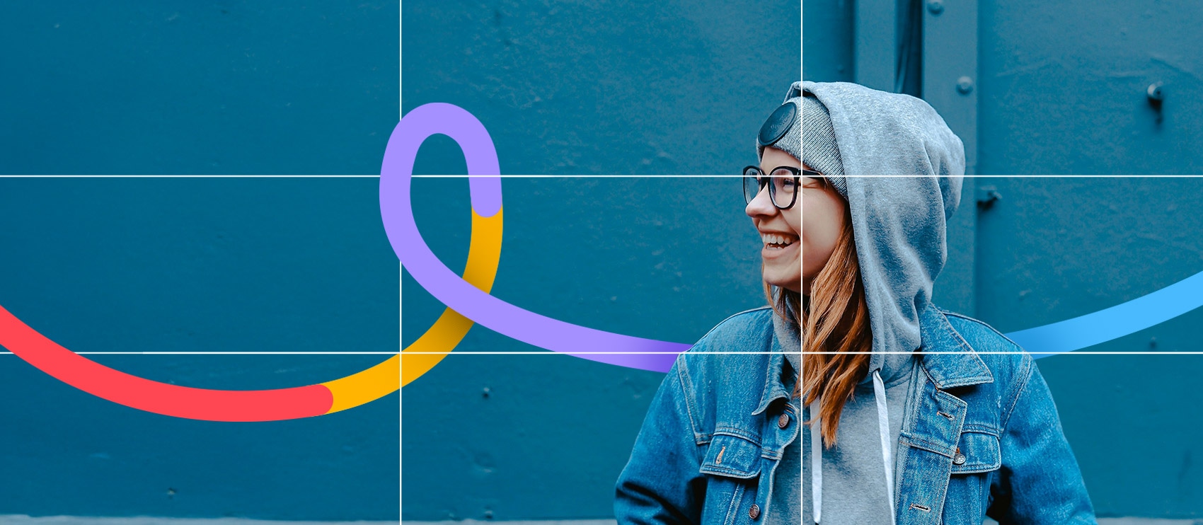 Young woman smiling in hoodie and denim jacket in front of a blue wall with colorful Path branding swirl overlay.
